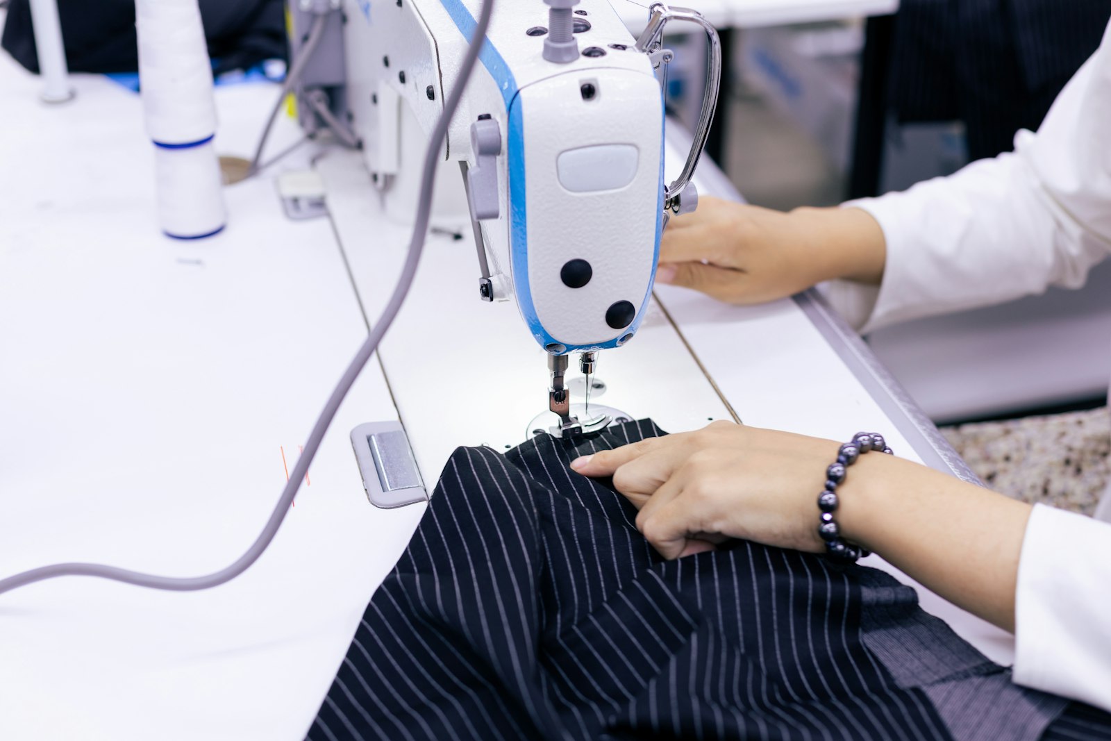 Worker operating sewing machine