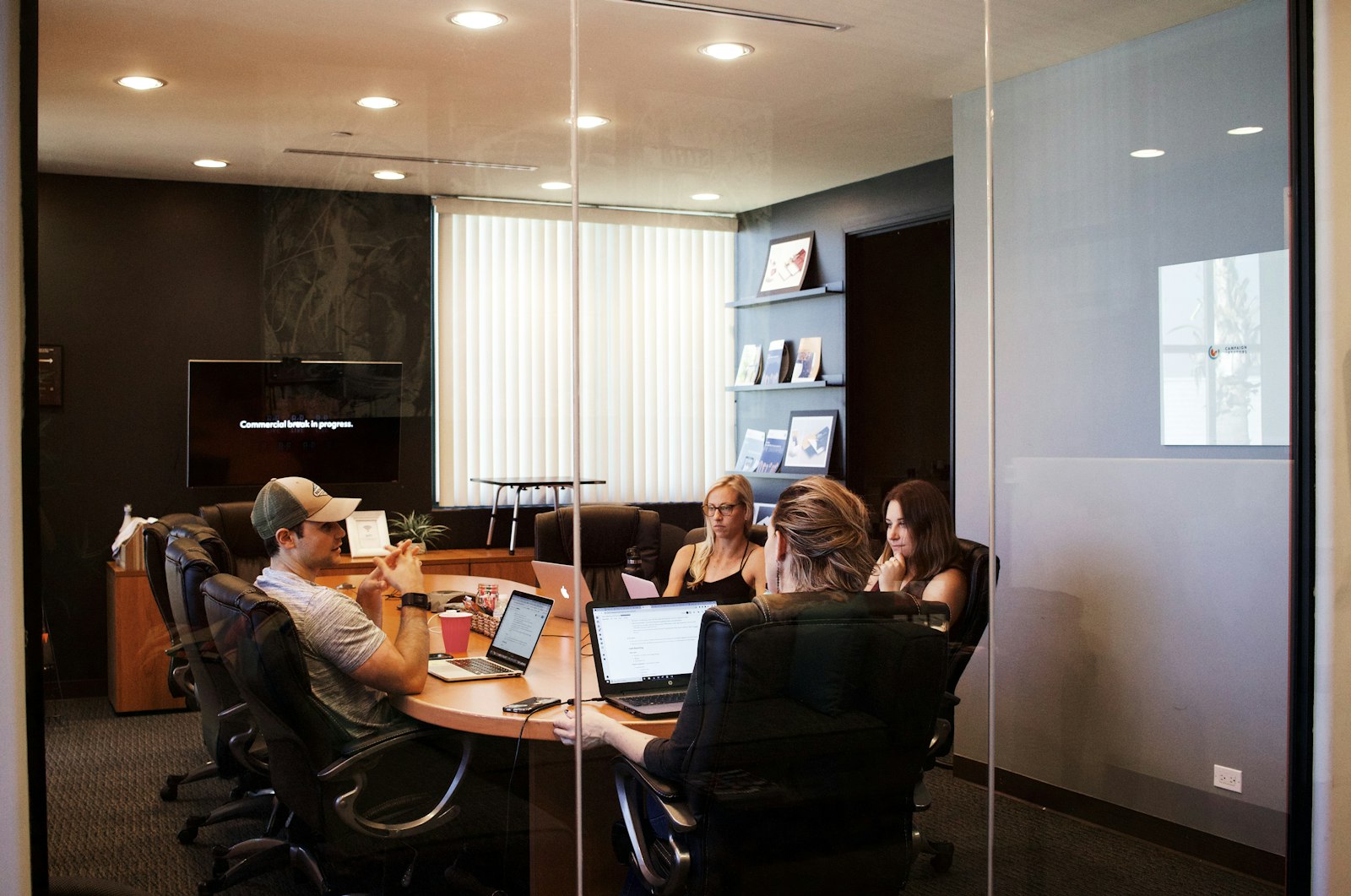 People at a table with laptops